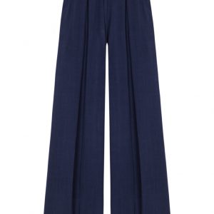 pantalon azul de lino con pinzas al frente y cinta bordada azul marino con crudo en la cintura paloma lajud primavera verano 2023